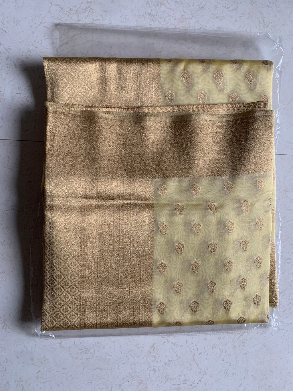 Golden Organza Designer Saree with Paisley Motifs and Intricate Patterned Border