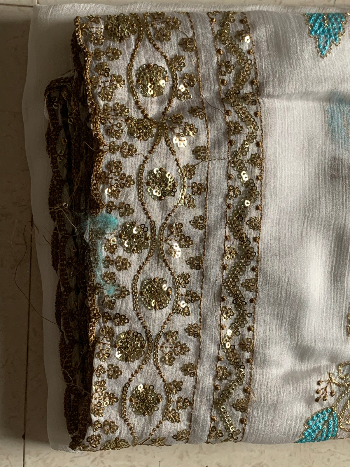 White Embroidered Georgette Saree with Gold Sequin Border & Multicolor Floral Motifs