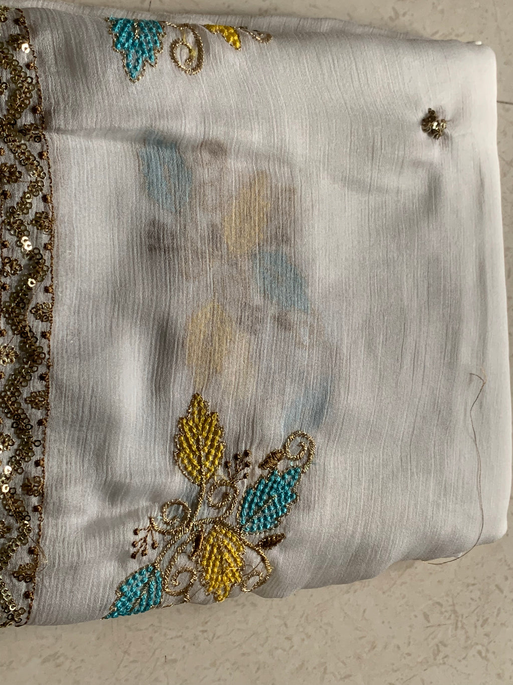 White Embroidered Georgette Saree with Gold Sequin Border & Multicolor Floral Motifs