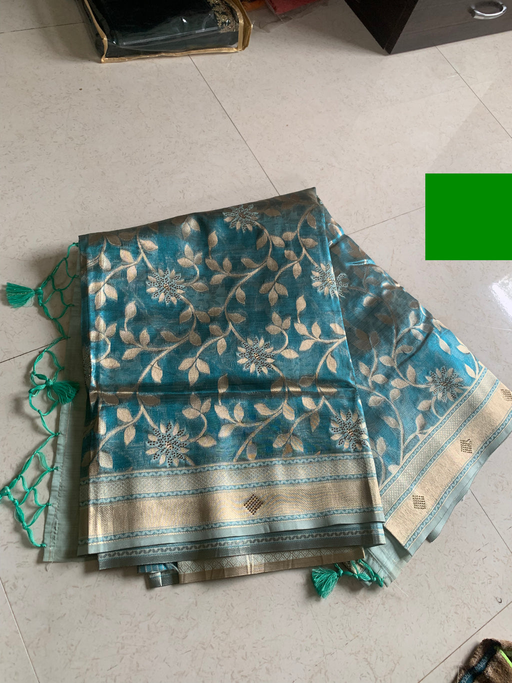 Teal Organza designer Saree with Gold Botanical Vines, Embellished Flowers & Tassels