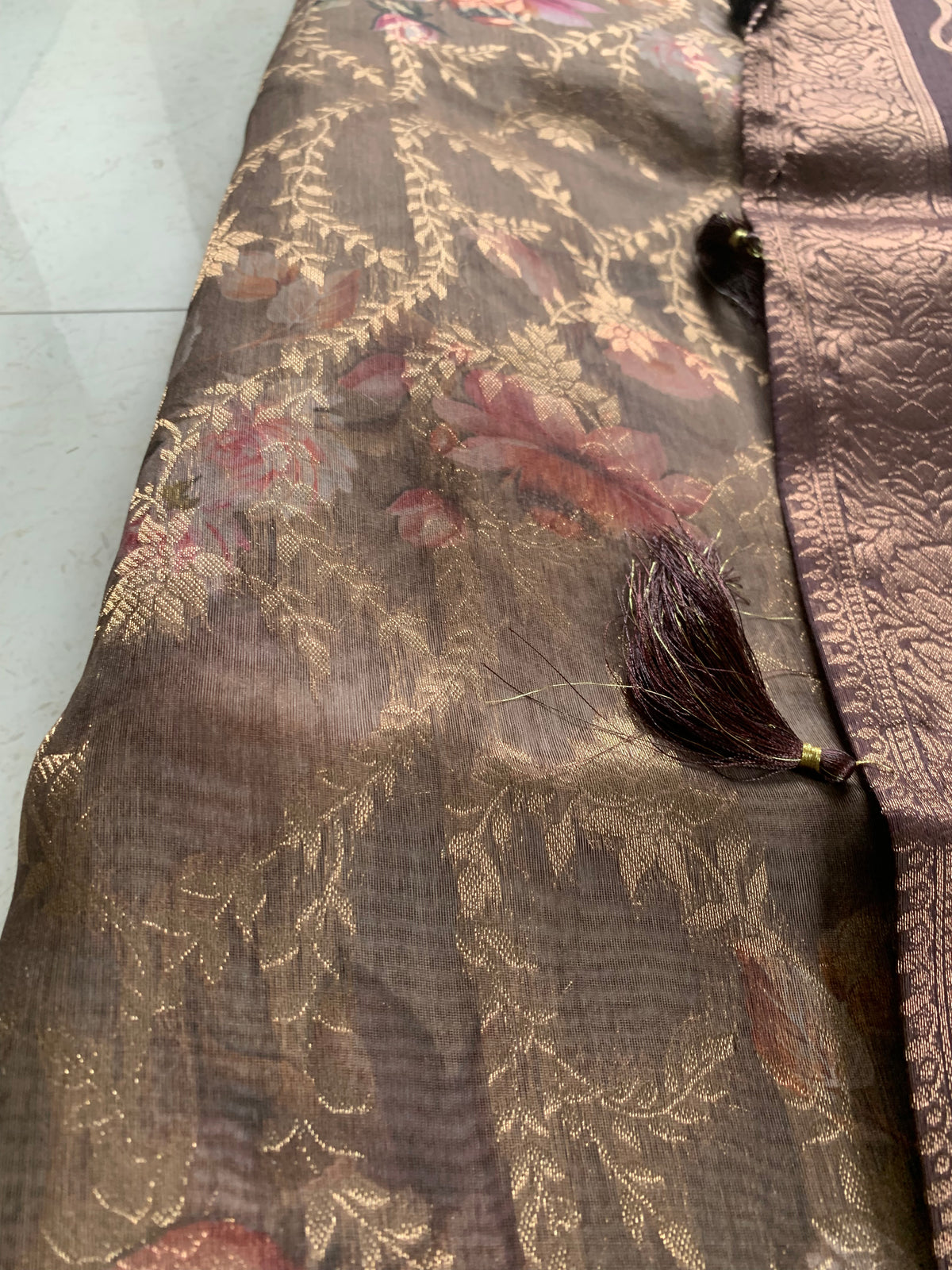 Brown Floral Organza Designer Saree with Woven Border & Tassel Detailing