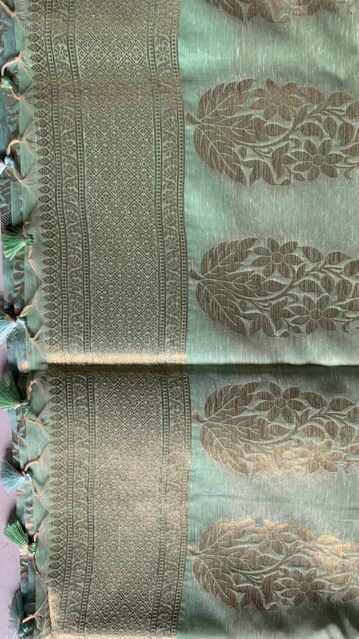 Mint Green Linen Silk Saree with Gold Floral Motifs & Tassel Edge